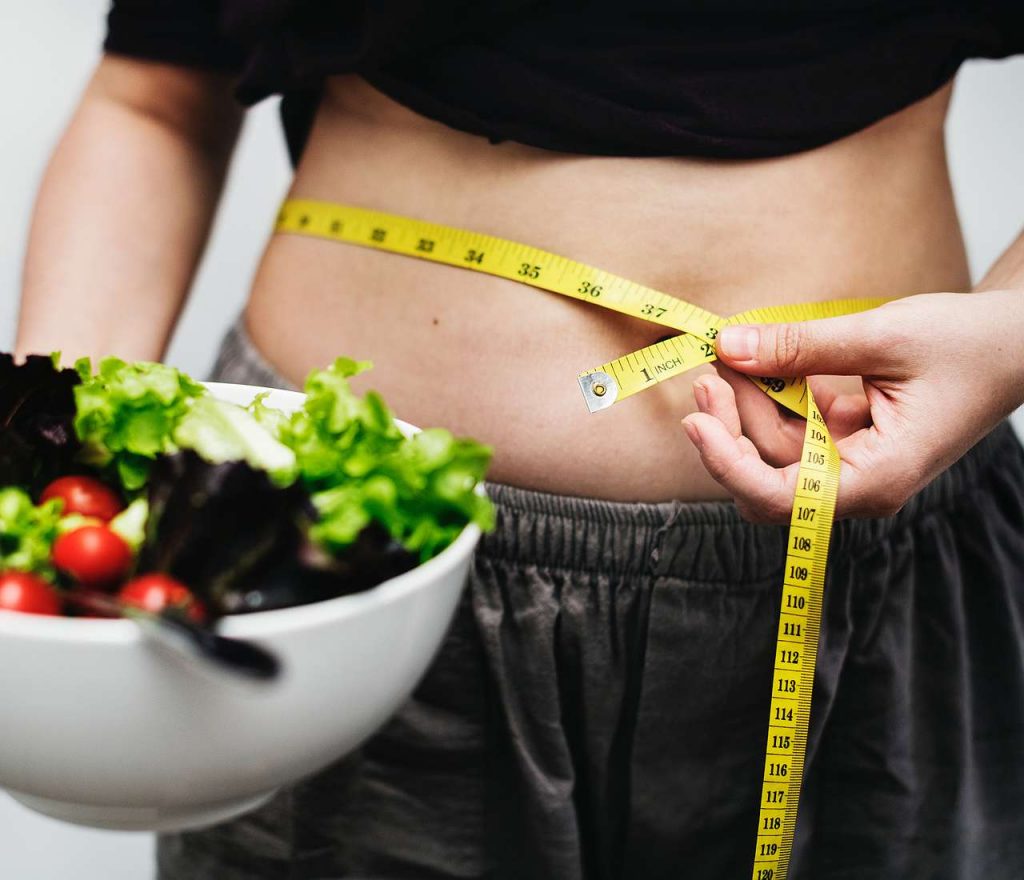 woman measuring her stomach