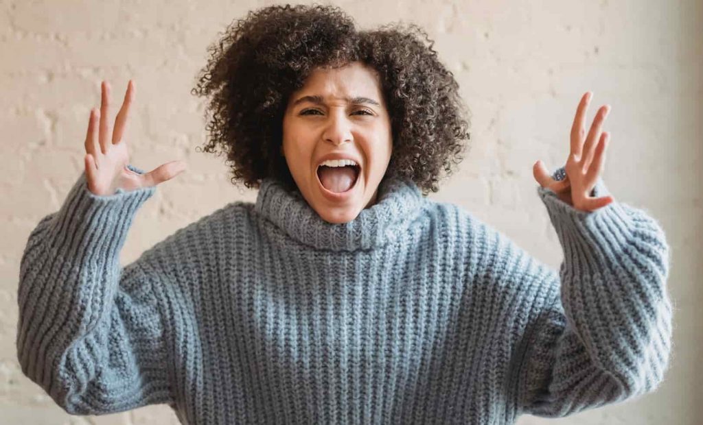 A woman shouting with rage